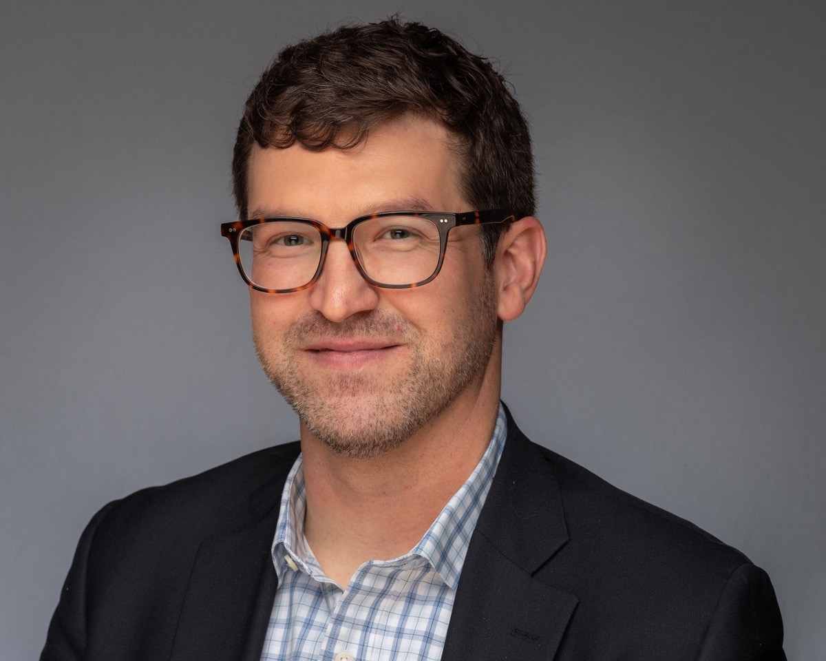Ryan Logan, Ph.D. headshot with glasses