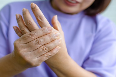 Image of a patient holding their own hand