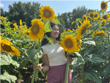 Melanie Barbini with sunflowers
