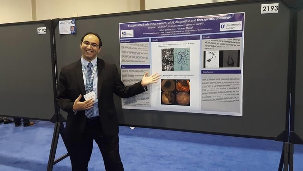 A fellow presenting their poster at a Gastroenterology conference