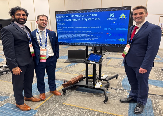 Three Primary Care residents at a digital poster session