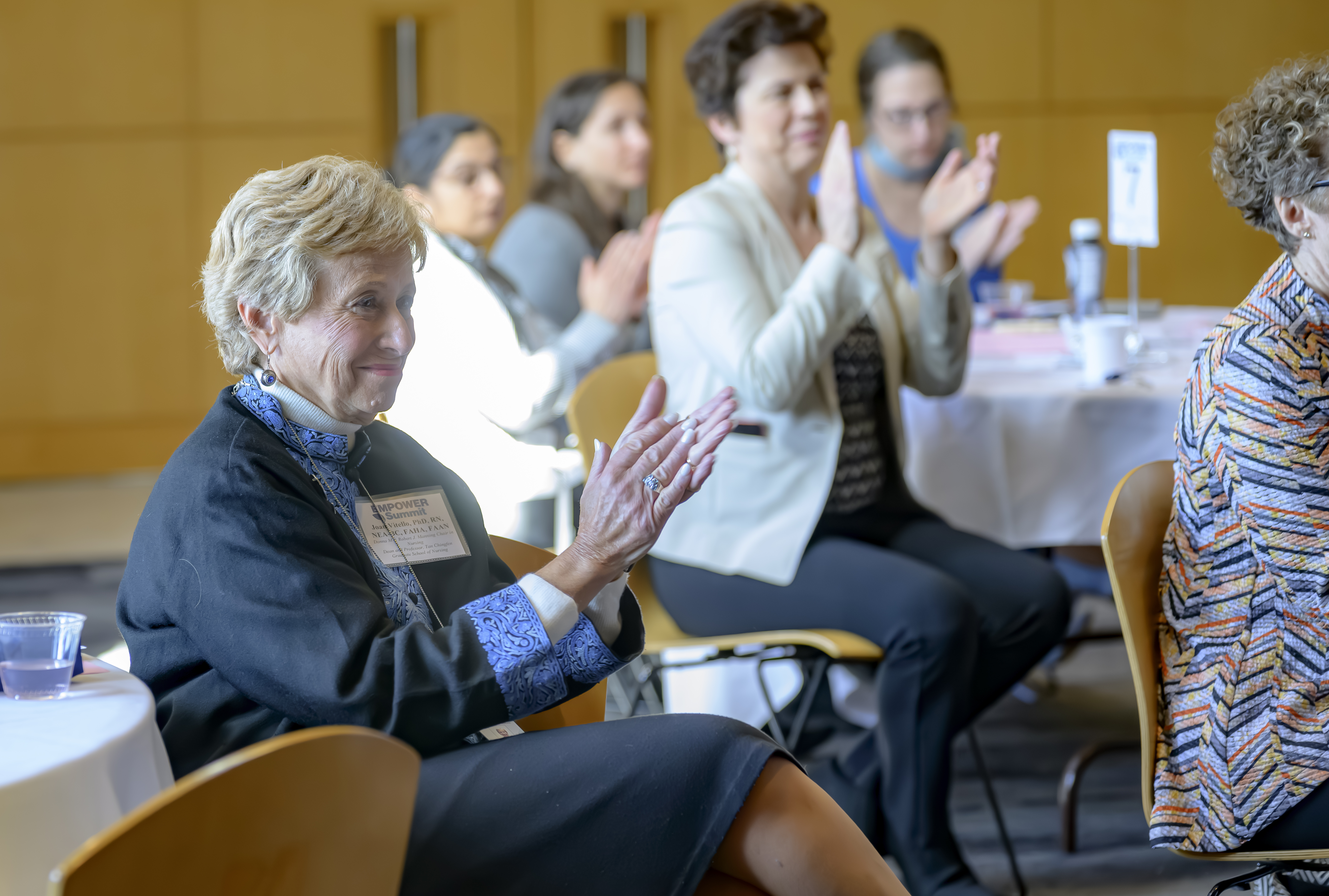 a group of women clapping