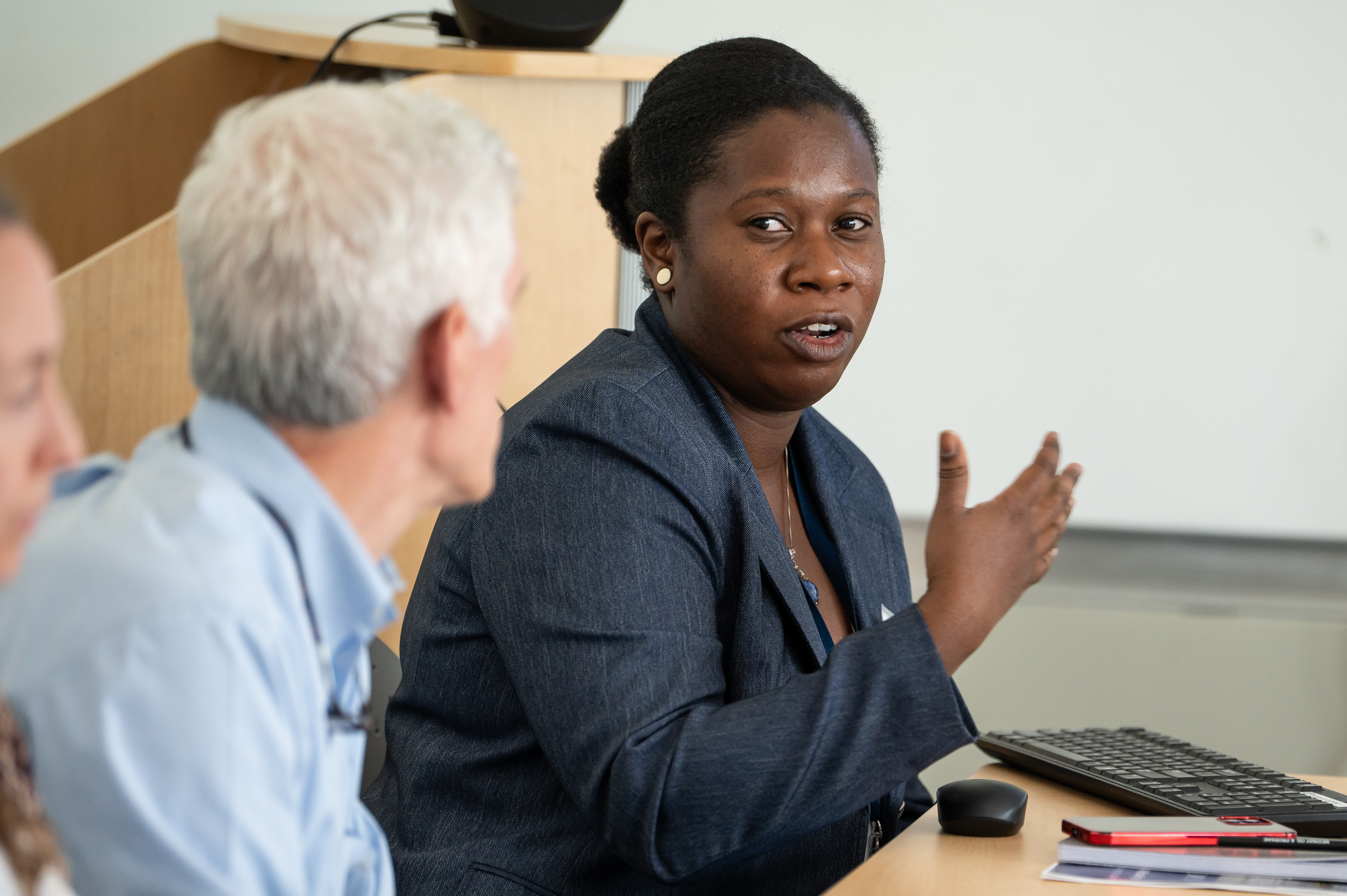 two people discuss important topics at education day