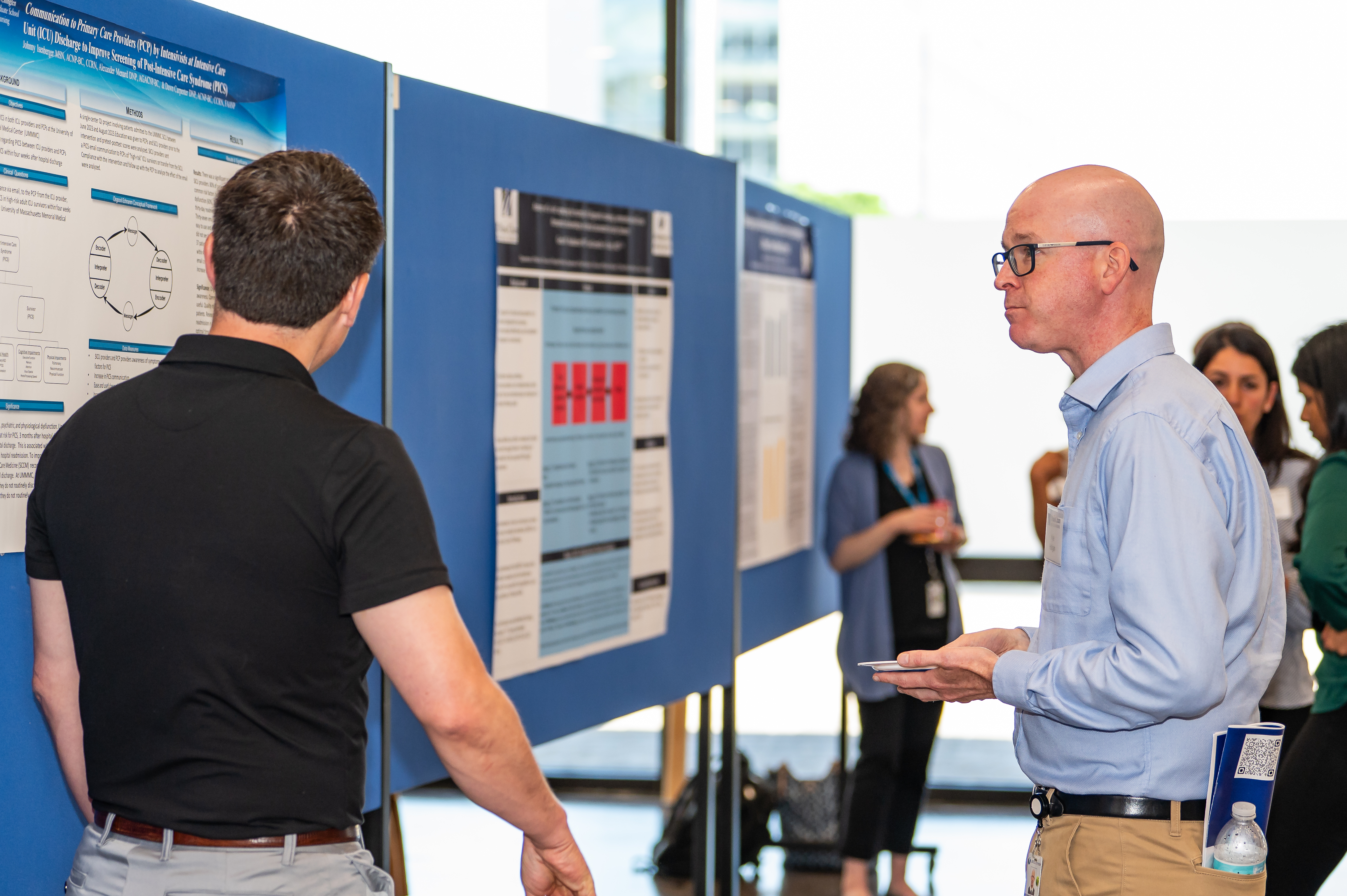 people discuss research at Education Day