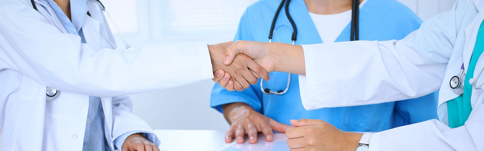 Two-Doctors-Shaking-Hands.png