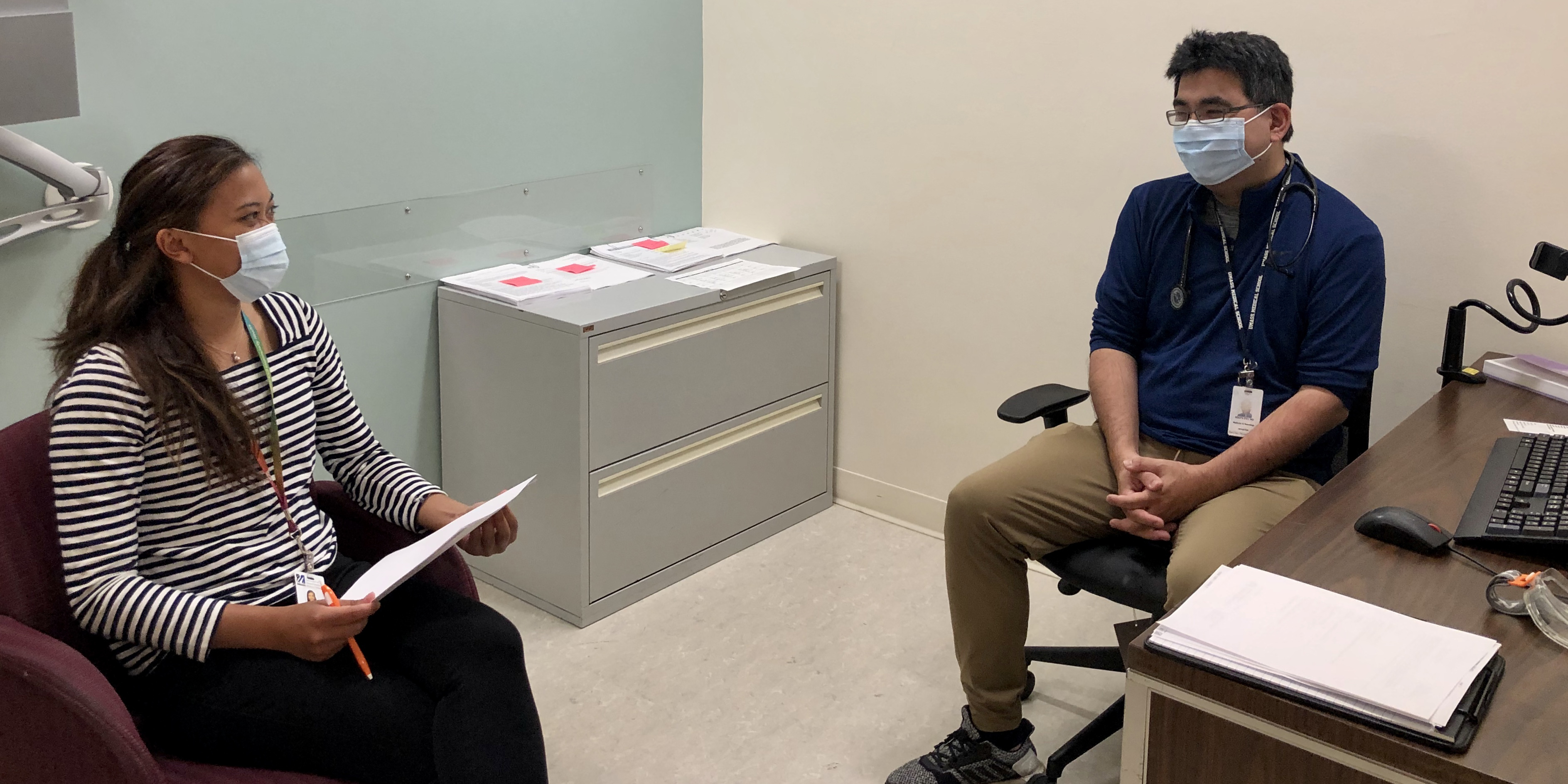 Students discussing care in an office