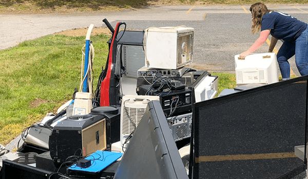 Image shows a pile of collected electronics