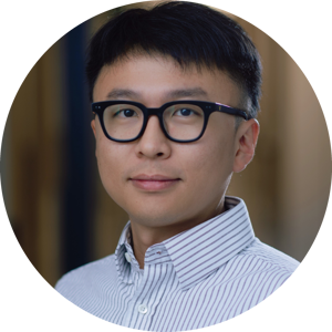 A headshot of Yu Qing, wearing glasses and wearing a light striped shirt, looking at the camera with a neutral expression.