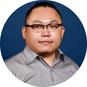 A headshot of Meng-Ju Wu, wearing glasses and a neatly trimmed goatee, wearing a striped shirt, set against a solid blue background