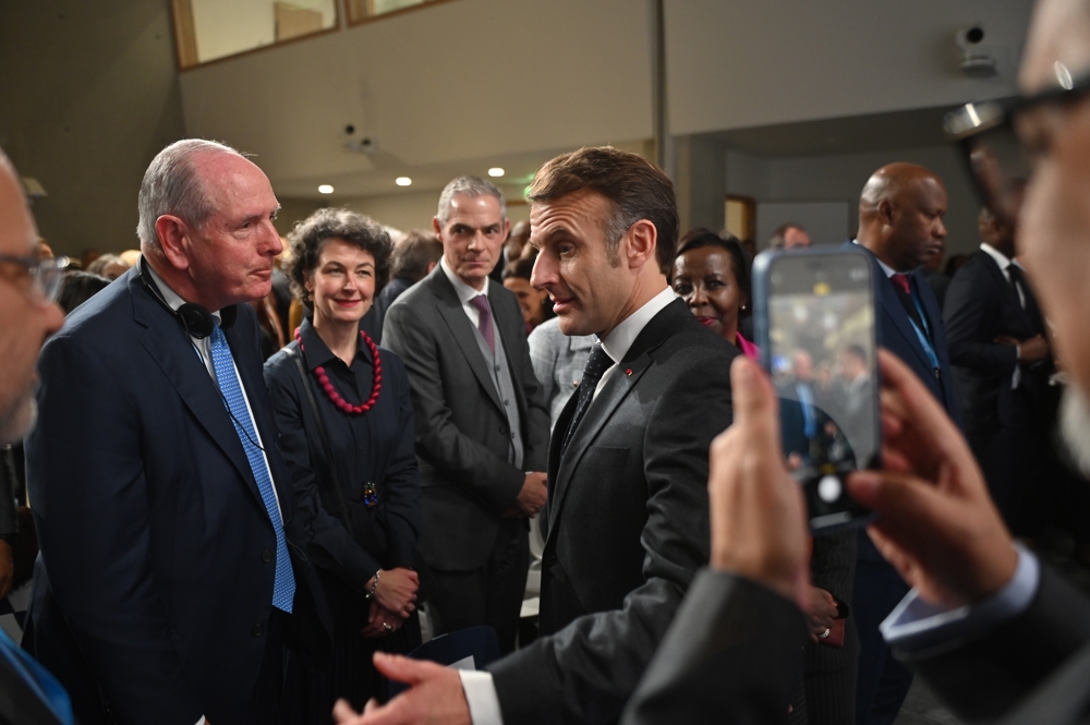 Chancellor Michael F. Collins with French President Emmanuel Macron at the WHO Academy&rsquo;s opening ceremony.
