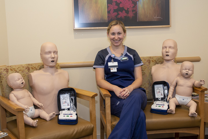 Liz Tollkuci with CPR mannikins