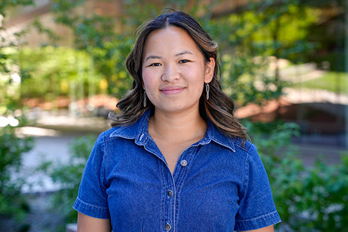Minhtam Tran standing outside wearing a blue shirt