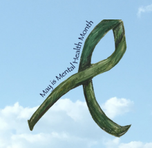 hand drawn green advocacy ribbon against a blue sky
