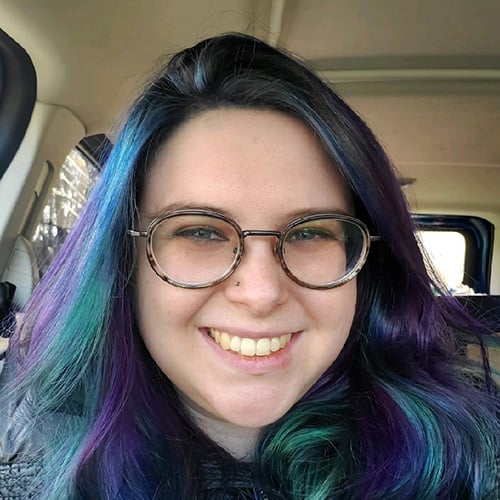 white woman with long blue and purple hair