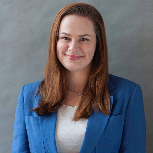 white woman with red shoulder length hair