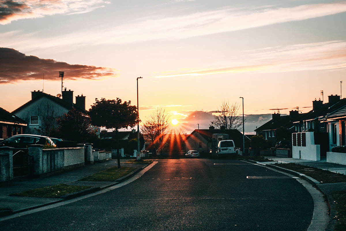 sunset over a neighborhood street