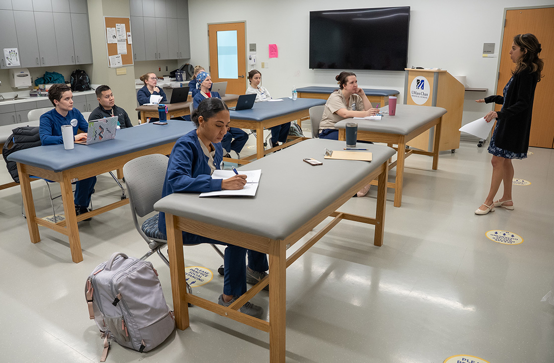  Teacher standing in front of students in a UMass Chan classroom