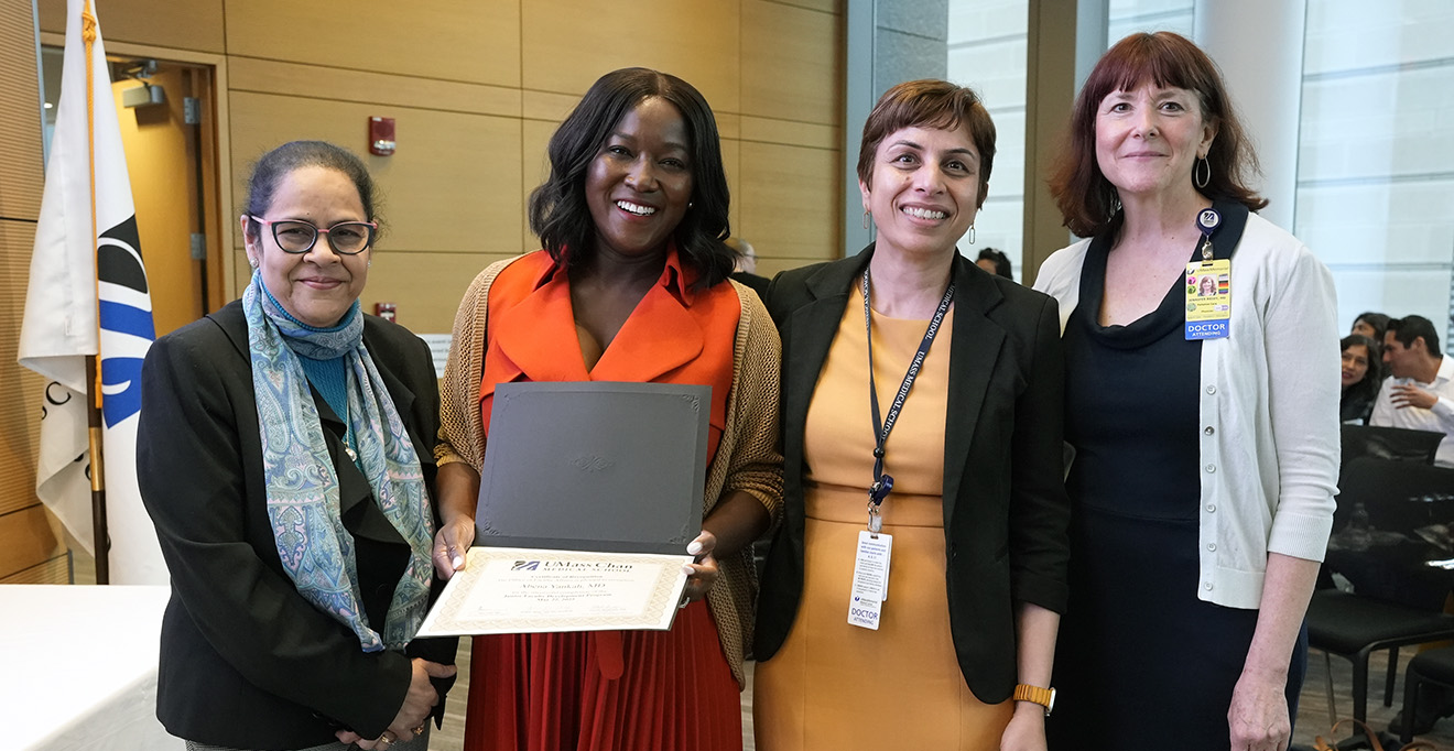 Photo of Abena Yankah, MD, with her Junior Faculty Development Program certificate alongside her mentor, Vandana Nagpal, MD; program director Jennifer Reidy, MD (right); and program co-director Pranoti Mandrekar, PhD (left
