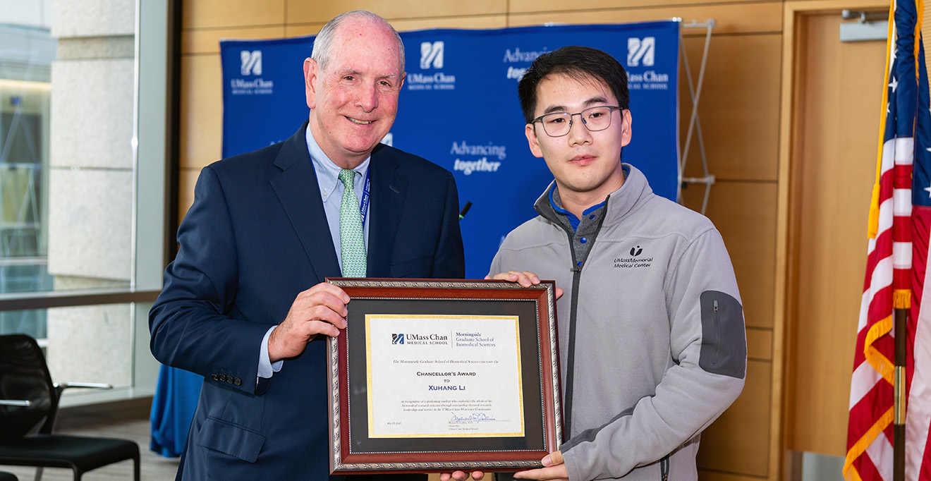Photo of Chancellor Michael F. Collins presented the 2025 Chancellor&rsquo;s Award to PhD candidate Xuhang Li.