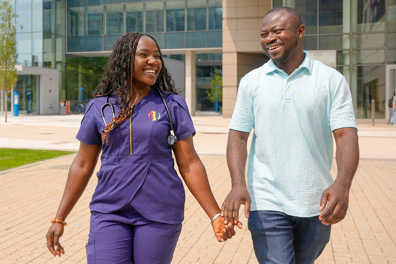 Lizzy Mirekuaa Lartey, RN, and her husband, Justice, wearing Heritage Scrubs.