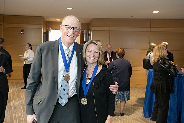 Chancellor’s Medal winners Michael Hirsh and Anne Gilroy share a moment.