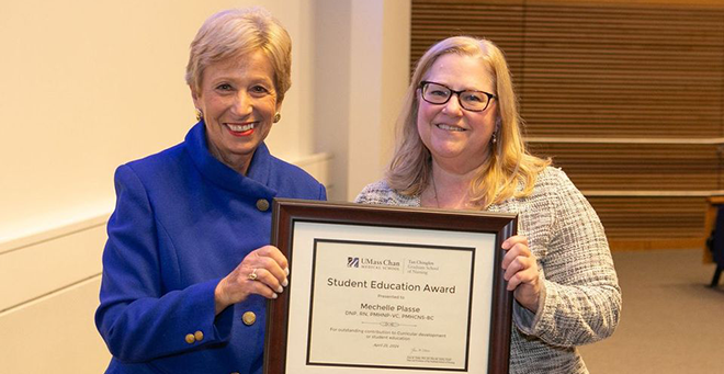 Joan Vitello-Cicciu, PhD, presents the Student Education Award to Mechelle Plasse, PhD, APRN. &nbsp;