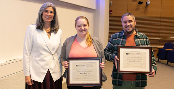 (L to R) Mary Ellen Lane, PhD, presents the Faculty Award for outstanding contributions to trainee mentoring and/or professional advancement by a postdoctoral associate to Rebecca Beiter, PhD, and Pablo Gimenez Gomez, PhD. &nbsp;