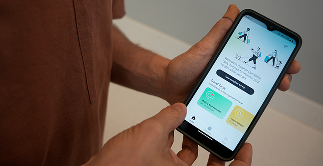 Travel Healthy app displayed on a cell phone
